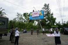Pembayaran Pajak Mandek, Reklame Ini Ditutupi Tulisan Belum Bayar Pajak