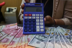 Rupiah Menguat ke Rp18.065 per Dolar AS, Sentimen Global Masih Bayangi